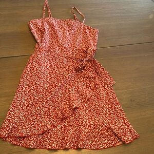 Adorable red dress with little designs on it